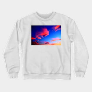 Plenty of bright pink clouds scattered on the yellow-blue sky Crewneck Sweatshirt